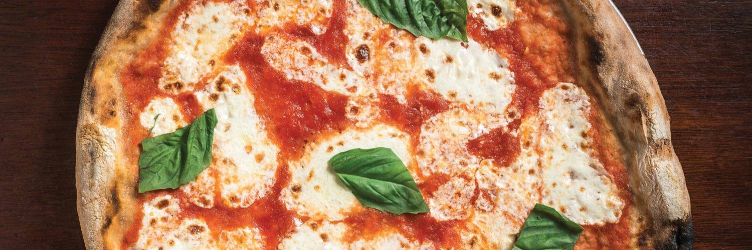 A delicious Margherita pizza with tomato and basil
